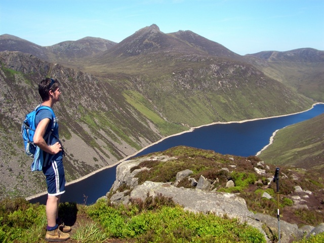 A walker looks over the Ben Crom reservoir deep in the Mournes