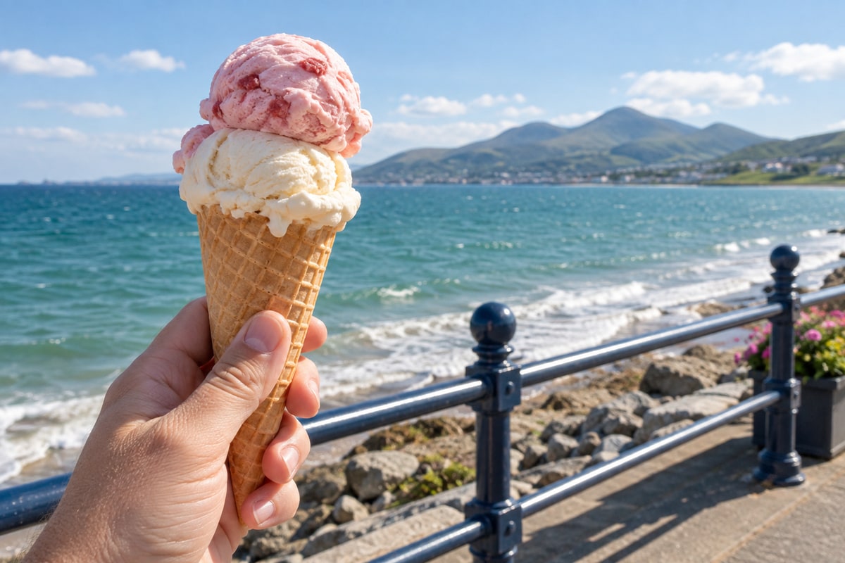 A delicious cone held against the promenade railings with the Mournes and sea in view