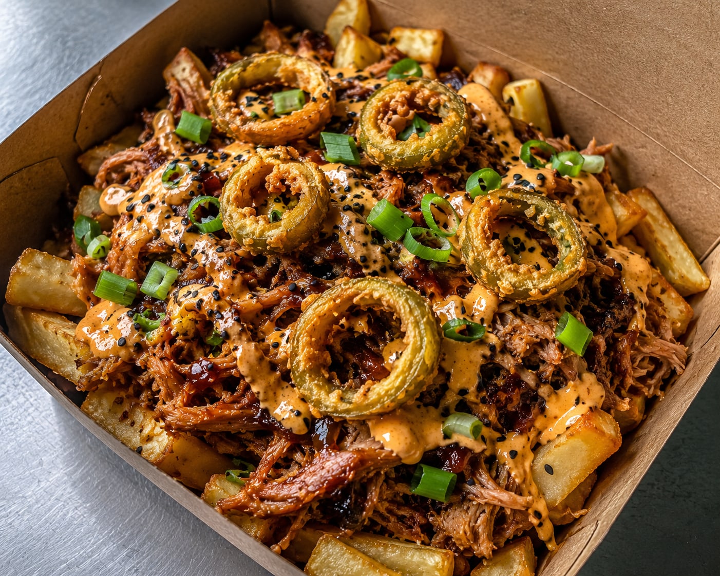 Chips loaded with BBQ pork, chipotle mayo and jalapeños