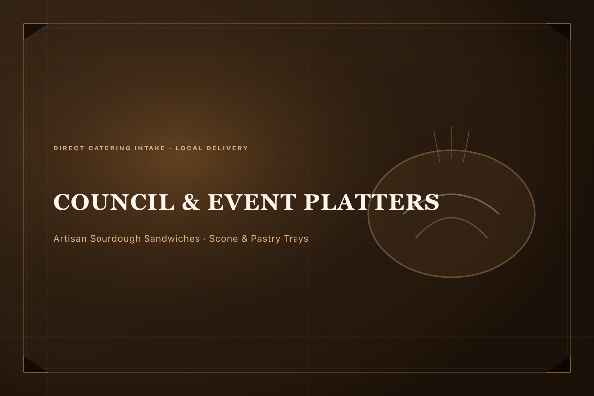Artisan sandwich and scone catering platter on dark slate board