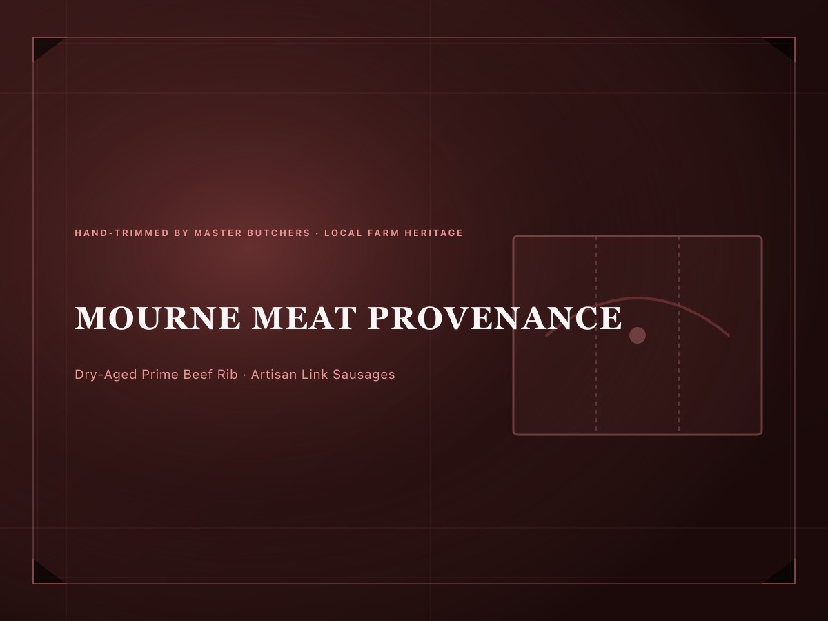 Prime Mourne dry-aged beef rib joint on a heavy butcher block with rosemary and sea salt